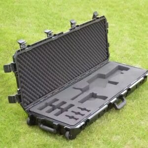 Empty custom foam rifle case with CNC-cut compartments for secure equipment storage