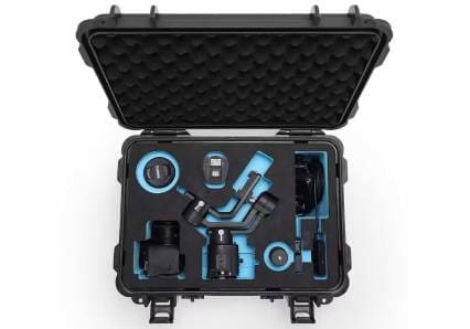 An open black hard-shell protective case with custom blue foam inserts housing a professional camera, lenses, and a gimbal stabilizer kit | Foamkart