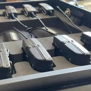 Custom foam packaging for multiple audio devices arranged in protective case